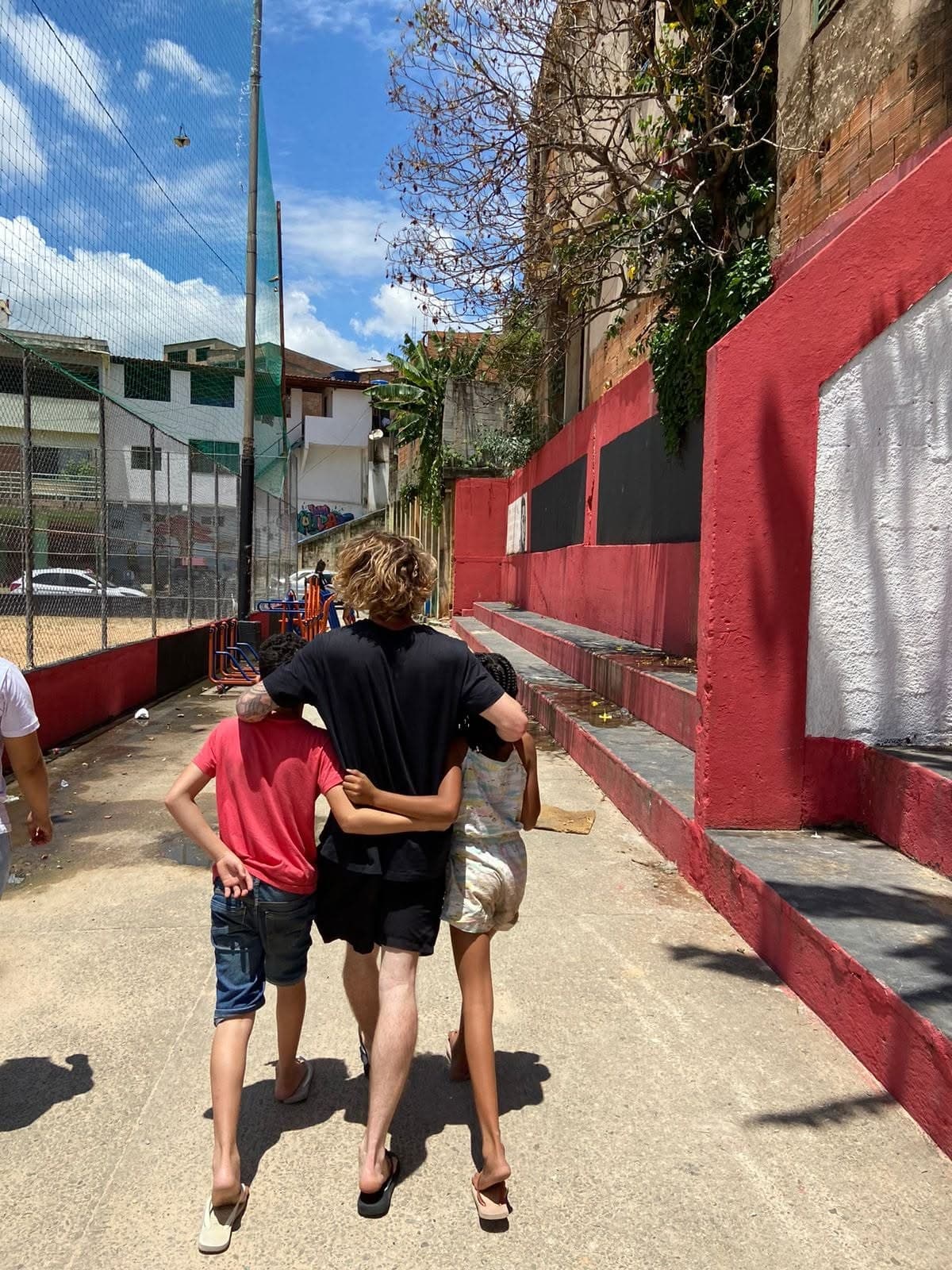 Walking together during a community visit in Brazil.